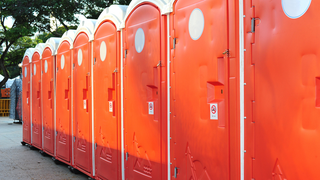 Woman Accidentally Forklifted Across a Festival Site in a Port-a-Potty
